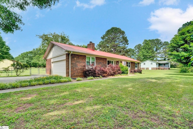203 Ponder Rd, Greer, SC 29651 - ranch-style home featuring brick siding, a chimney, a garage, a metal roof, and driveway