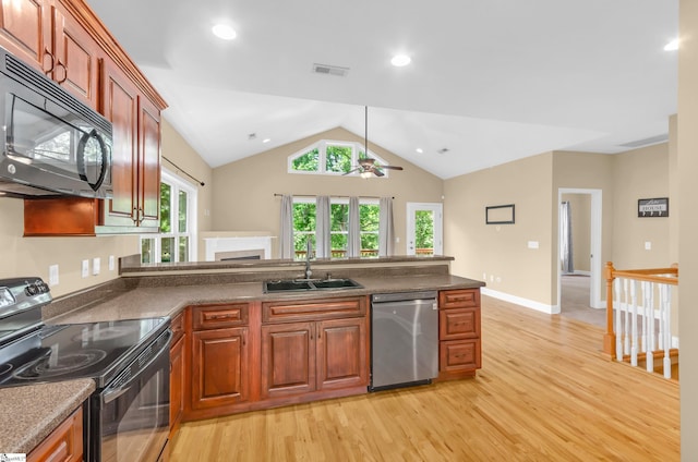 214 New Salem Dr, Anderson, SC 29625 - kitchen featuring black appliances, light wood-type flooring, ceiling fan, lofted ceiling, and a peninsula