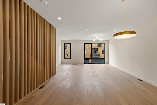 18 Nordic Ln, Greenville, SC 29609 - unfurnished living room featuring recessed lighting, light wood finished floors, and a chandelier
