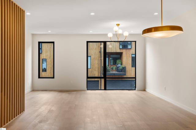 18 Nordic Ln, Greenville, SC 29609 - unfurnished room featuring wood finished floors, recessed lighting, and a chandelier