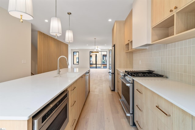 18 Nordic Ln, Greenville, SC 29609 - kitchen featuring light brown cabinetry, appliances with stainless steel finishes, light wood-style flooring, modern cabinets, and recessed lighting