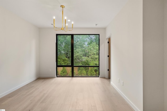 18 Nordic Ln, Greenville, SC 29609 - unfurnished room featuring a chandelier and light wood-type flooring