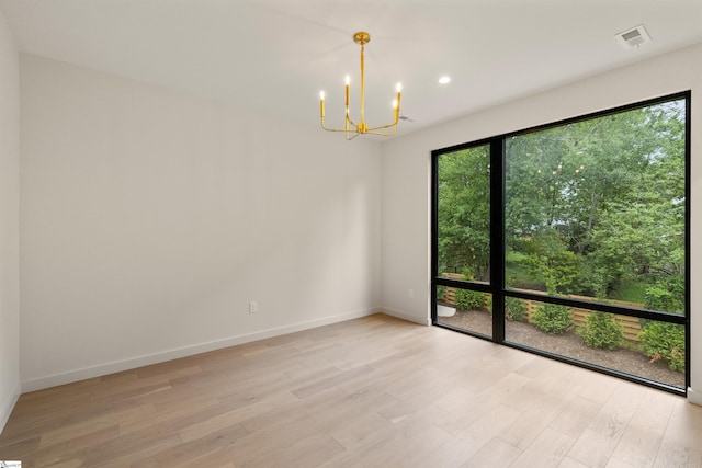 18 Nordic Ln, Greenville, SC 29609 - unfurnished room with a chandelier, light wood-style floors, and recessed lighting