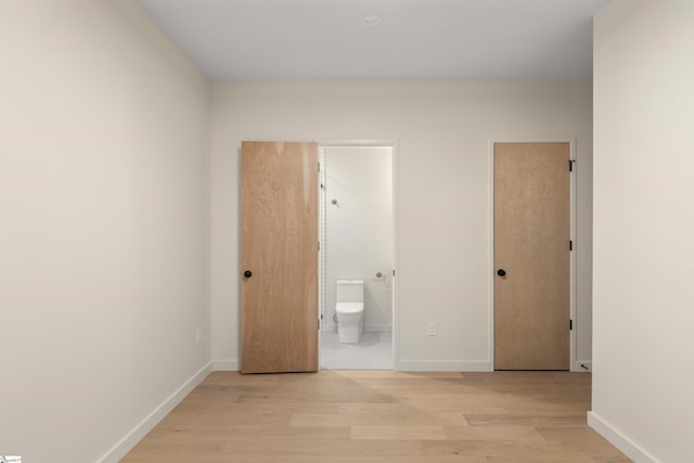 18 Nordic Ln, Greenville, SC 29609 - unfurnished bedroom with light wood-style floors and ensuite bathroom