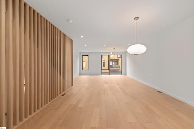 20 Nordic Ln, Greenville, SC 29609 - unfurnished living room with light wood-style flooring and recessed lighting