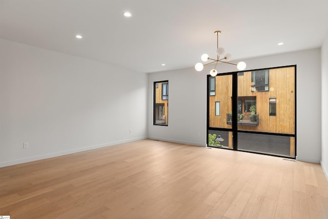 20 Nordic Ln, Greenville, SC 29609 - empty room with a chandelier, light wood-style floors, and recessed lighting
