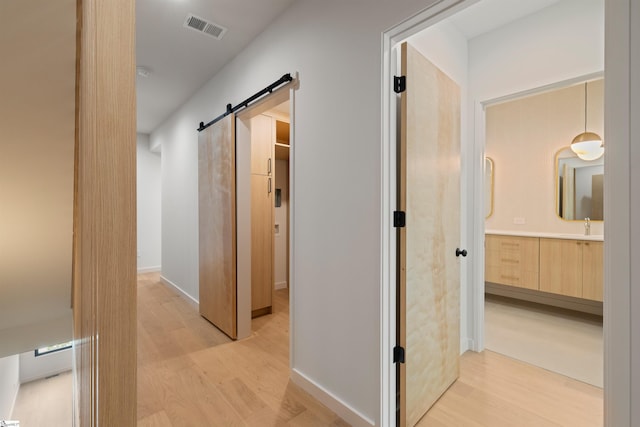 20 Nordic Ln, Greenville, SC 29609 - corridor featuring light wood-type flooring and a barn door