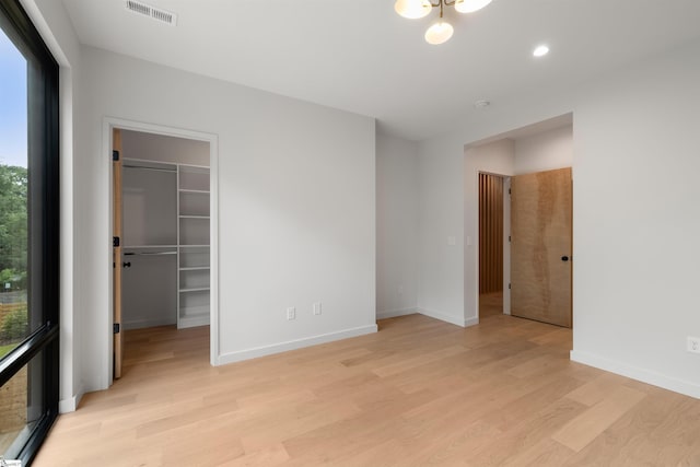 20 Nordic Ln, Greenville, SC 29609 - unfurnished bedroom with light wood-style floors, a walk in closet, a closet, and recessed lighting