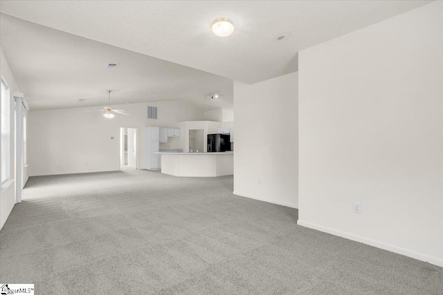 2013 Small Meadows Ct, Fountain Inn, SC 29644 - unfurnished living room featuring lofted ceiling, light colored carpet, and ceiling fan