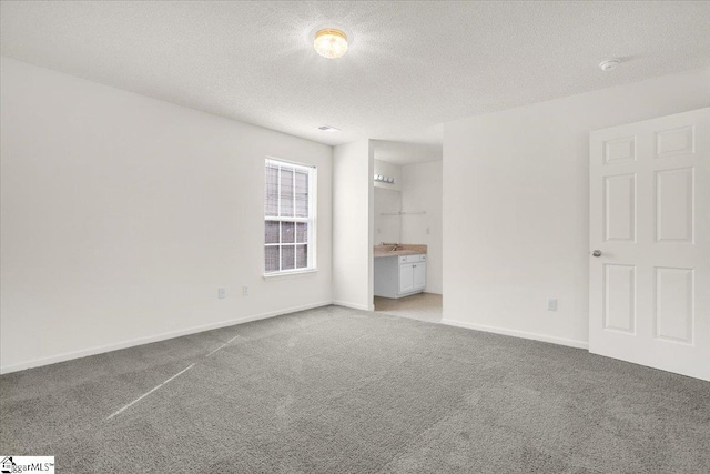 2013 Small Meadows Ct, Fountain Inn, SC 29644 - unfurnished bedroom with carpet flooring, a textured ceiling, and ensuite bath