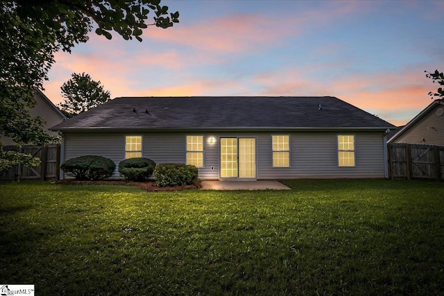 2013 Small Meadows Ct, Fountain Inn, SC 29644 - back of property at dusk featuring a patio and a gate