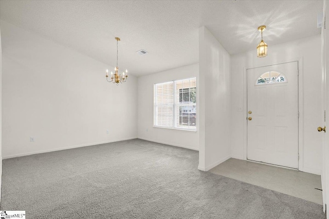 2013 Small Meadows Ct, Fountain Inn, SC 29644 - carpeted entryway with a chandelier and baseboards