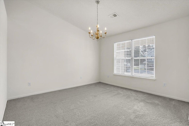 2013 Small Meadows Ct, Fountain Inn, SC 29644 - carpeted spare room with a chandelier and a textured ceiling