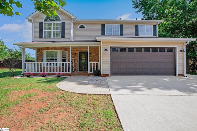 101 Bitternut Ln, Taylors, SC 29687 - traditional-style home featuring covered porch, driveway, a garage, and a front yard