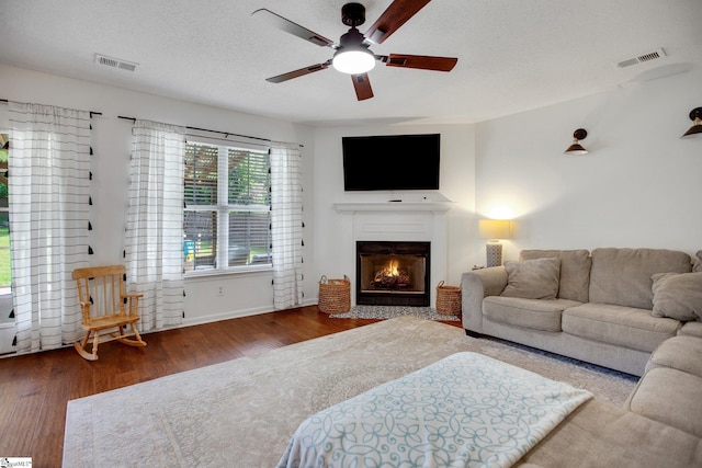 101 Bitternut Ln, Taylors, SC 29687 - living area with wood finished floors, a ceiling fan, and a fireplace with flush hearth