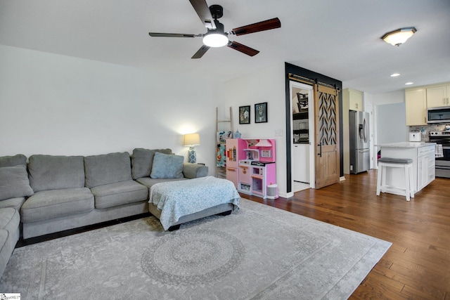 101 Bitternut Ln, Taylors, SC 29687 - living room featuring a barn door, ceiling fan, dark wood finished floors, and recessed lighting