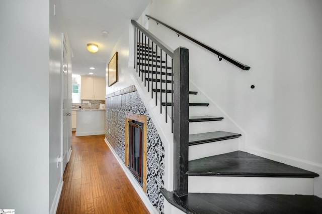 101 Bitternut Ln, Taylors, SC 29687 - stairway featuring a fireplace and wood finished floors