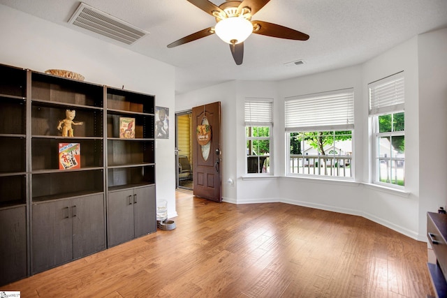 101 Bitternut Ln, Taylors, SC 29687 - unfurnished living room featuring light wood-type flooring and ceiling fan
