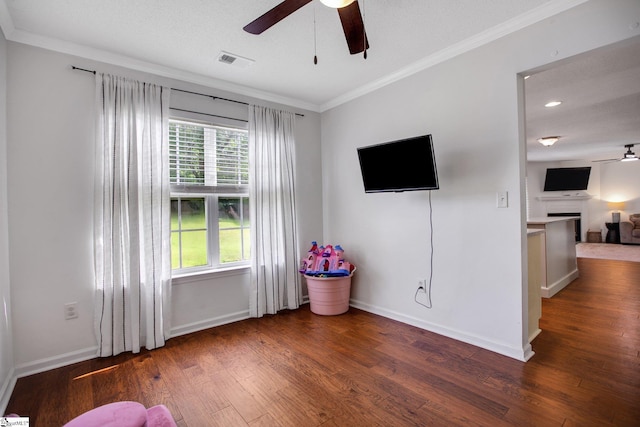 101 Bitternut Ln, Taylors, SC 29687 - living room featuring ceiling fan, crown molding, wood finished floors, and a fireplace