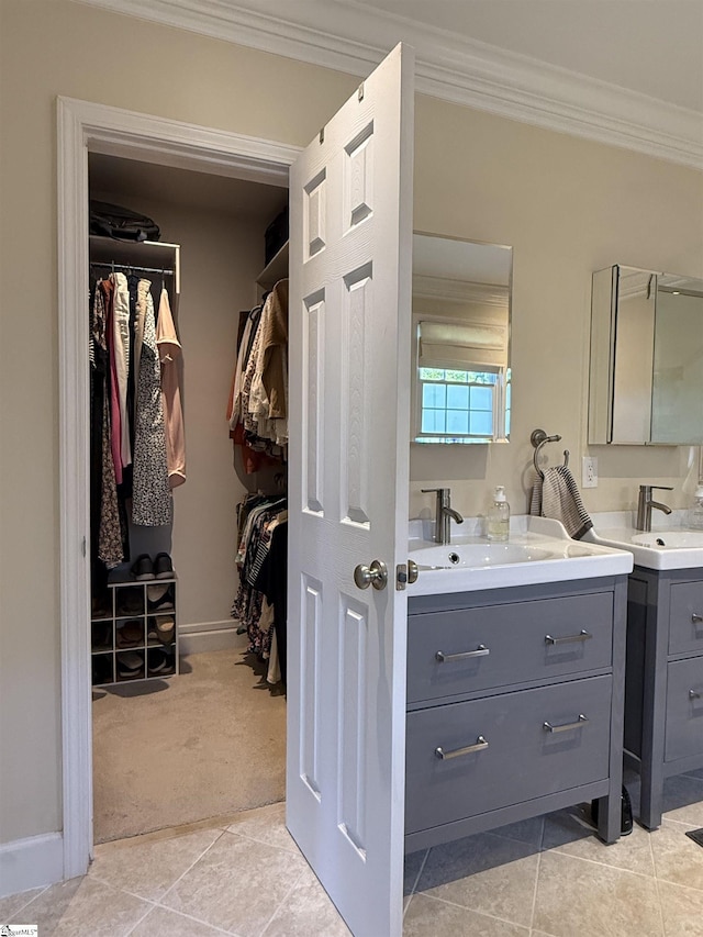 103 Crestview Cir, Greer, SC 29651 - full bathroom featuring ornamental molding, two vanities, a walk in closet, and tile patterned floors