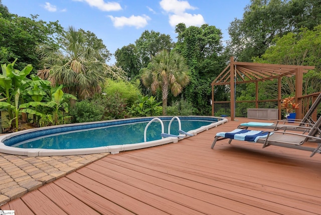 103 Crestview Cir, Greer, SC 29651 - swimming pool featuring a wooden deck and view of wooded area