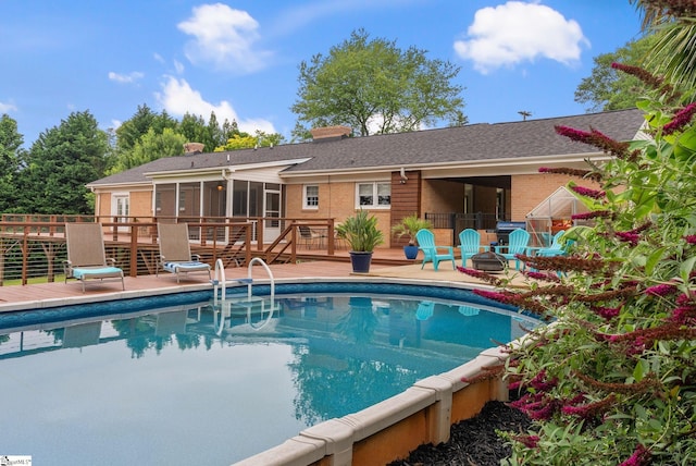 103 Crestview Cir, Greer, SC 29651 - swimming pool featuring a deck, a sunroom, and a fire pit