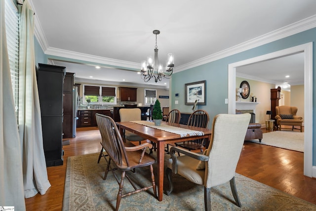 103 Crestview Cir, Greer, SC 29651 - dining space featuring a chandelier, wood finished floors, ornamental molding, recessed lighting, and a fireplace