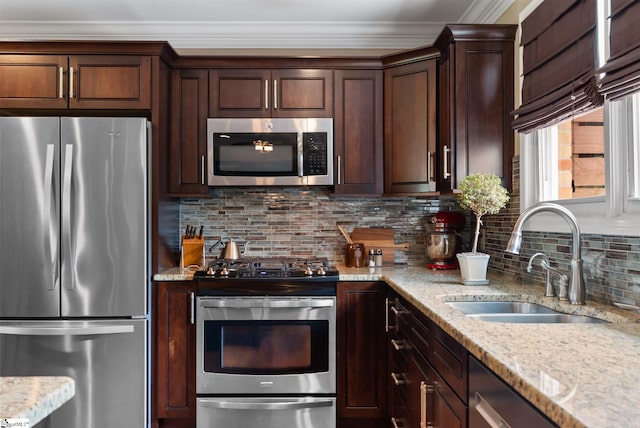103 Crestview Cir, Greer, SC 29651 - kitchen with appliances with stainless steel finishes, crown molding, decorative backsplash, light stone countertops, and dark brown cabinets