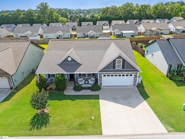 257 Highland Springs Loop, Inman, SC 29349 - view of front facade featuring a residential view, a garage, concrete driveway, and stone siding
