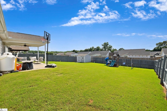 257 Highland Springs Loop, Inman, SC 29349 - fenced backyard featuring a playground, a storage unit, a patio, a residential view, and ceiling fan