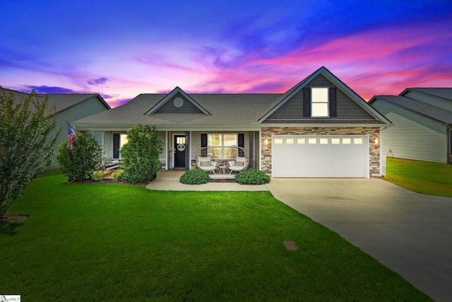 257 Highland Springs Loop, Inman, SC 29349 - view of front of property featuring covered porch, driveway, a front lawn, a garage, and stone siding