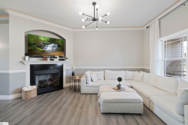 257 Highland Springs Loop, Inman, SC 29349 - living area with wood finished floors, crown molding, a chandelier, and a fireplace