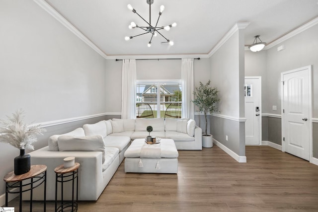 257 Highland Springs Loop, Inman, SC 29349 - living room featuring a chandelier, ornamental molding, and wood finished floors
