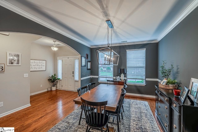 208 Castleton Cir, Boiling Springs, SC 29316 - dining area with arched walkways, wood finished floors, crown molding, and a chandelier
