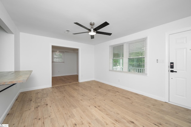 661 Maple Dr, Greer, SC 29651 - unfurnished living room with a ceiling fan and light wood-type flooring