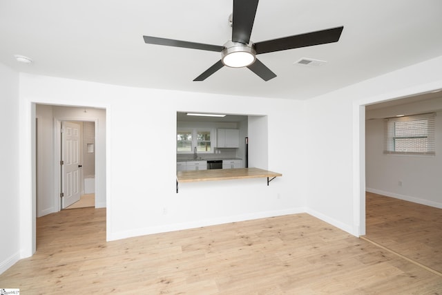 661 Maple Dr, Greer, SC 29651 - unfurnished living room with ceiling fan and light wood-type flooring