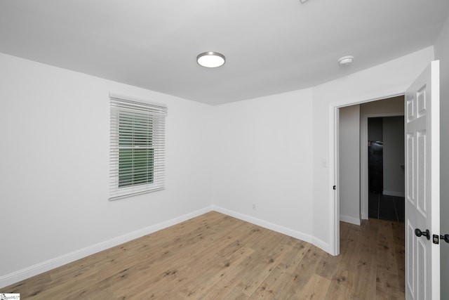 661 Maple Dr, Greer, SC 29651 - empty room with light wood-type flooring and a smoke detector