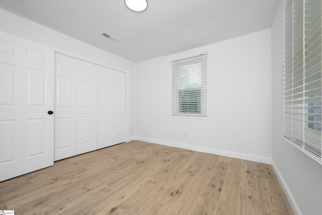 661 Maple Dr, Greer, SC 29651 - unfurnished bedroom with wood finished floors and a closet