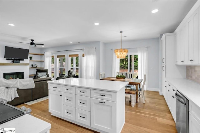 11 Echo Dr, Travelers Rest, SC 29690 - kitchen featuring stainless steel dishwasher, a lit fireplace, plenty of natural light, light countertops, and recessed lighting