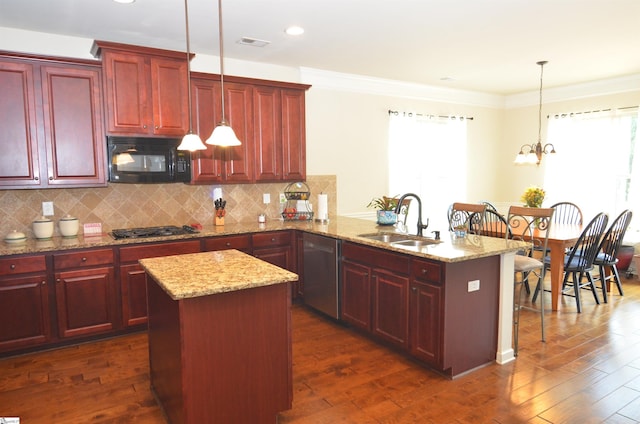108 Dillard Creek Ct, Greer, SC 29651 - kitchen with stainless steel appliances, reddish brown cabinets, a peninsula, a kitchen island, and backsplash