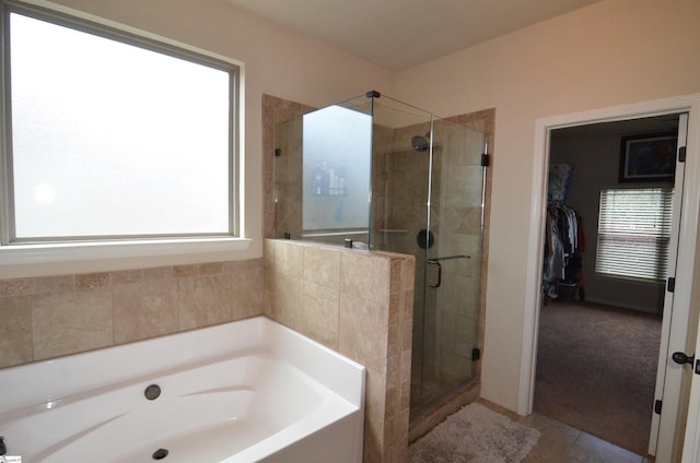 108 Dillard Creek Ct, Greer, SC 29651 - bathroom featuring a bath, a stall shower, a spacious closet, and tile patterned floors