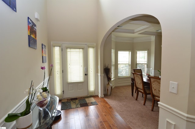 108 Dillard Creek Ct, Greer, SC 29651 - foyer featuring arched walkways, a high ceiling, wood-type flooring, and crown molding