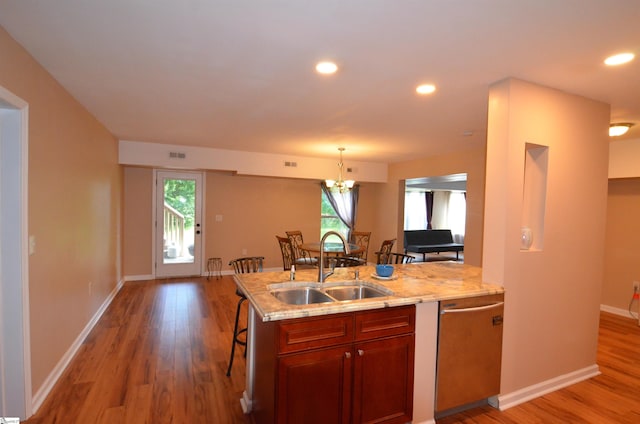 108 Dillard Creek Ct, Greer, SC 29651 - kitchen featuring stainless steel dishwasher, light wood finished floors, light stone countertops, healthy amount of natural light, and recessed lighting