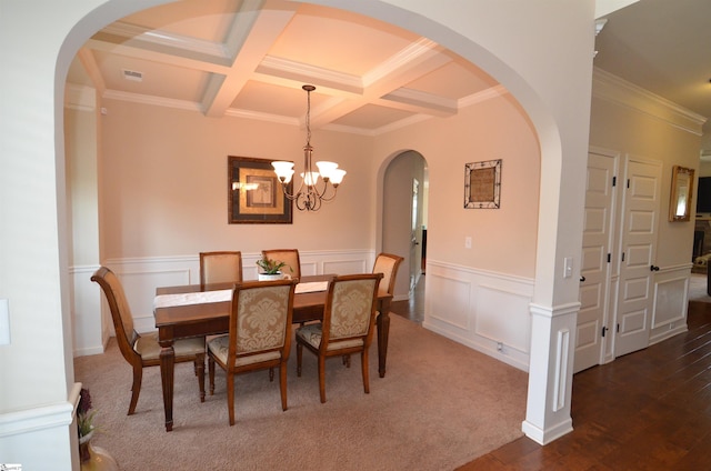 108 Dillard Creek Ct, Greer, SC 29651 - dining area with ornamental molding, beam ceiling, coffered ceiling, a chandelier, and a decorative wall