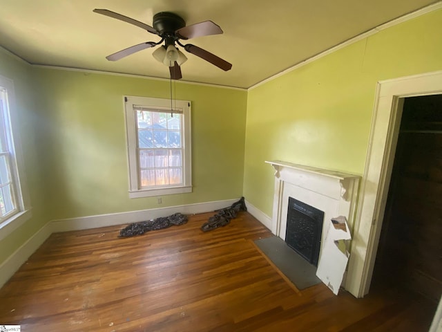 719 Chestnut St, Laurens, SC 29360 - unfurnished living room featuring crown molding, a fireplace with flush hearth, ceiling fan, and wood finished floors