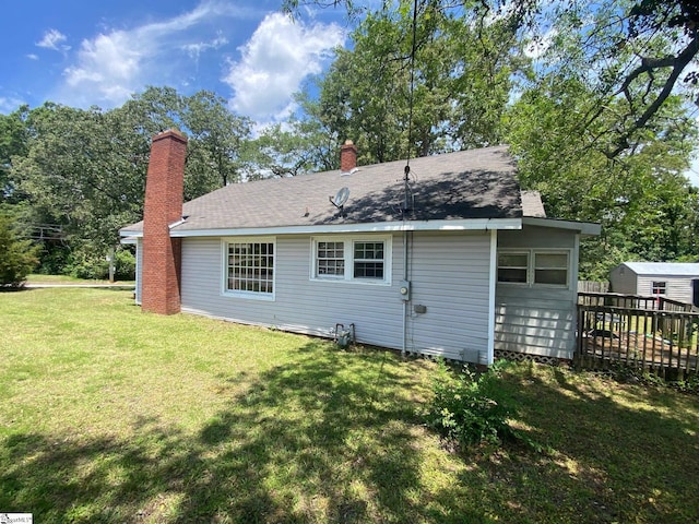 719 Chestnut St, Laurens, SC 29360 - rear view of house with a lawn and a chimney