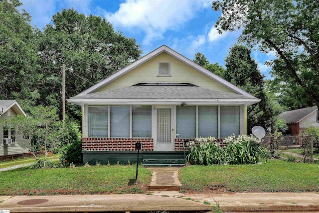 712 W Main St, Easley, SC 29640 - bungalow-style house with a sunroom, brick siding, and a shingled roof