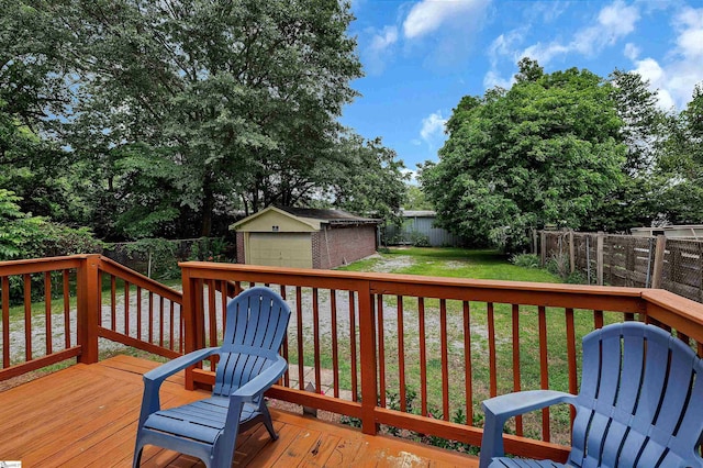 712 W Main St, Easley, SC 29640 - wooden terrace featuring a detached garage, a fenced backyard, and an outdoor structure