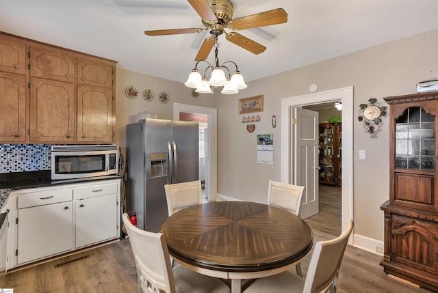 712 W Main St, Easley, SC 29640 - dining area featuring wood finished floors and a ceiling fan