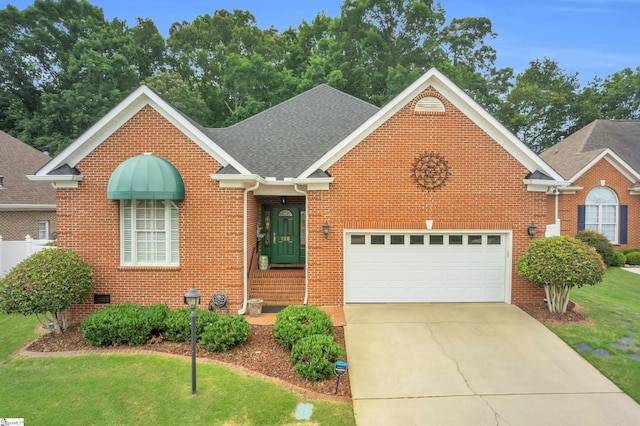 128 Banbury Cir, Simpsonville, SC 29650 - traditional-style house with brick siding, concrete driveway, a garage, and a front yard